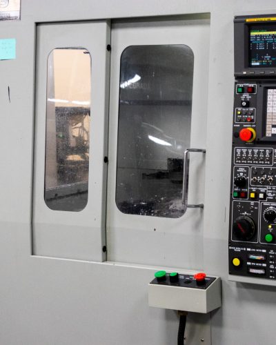 A modern CNC machine control panel used for precise industrial processes indoors.